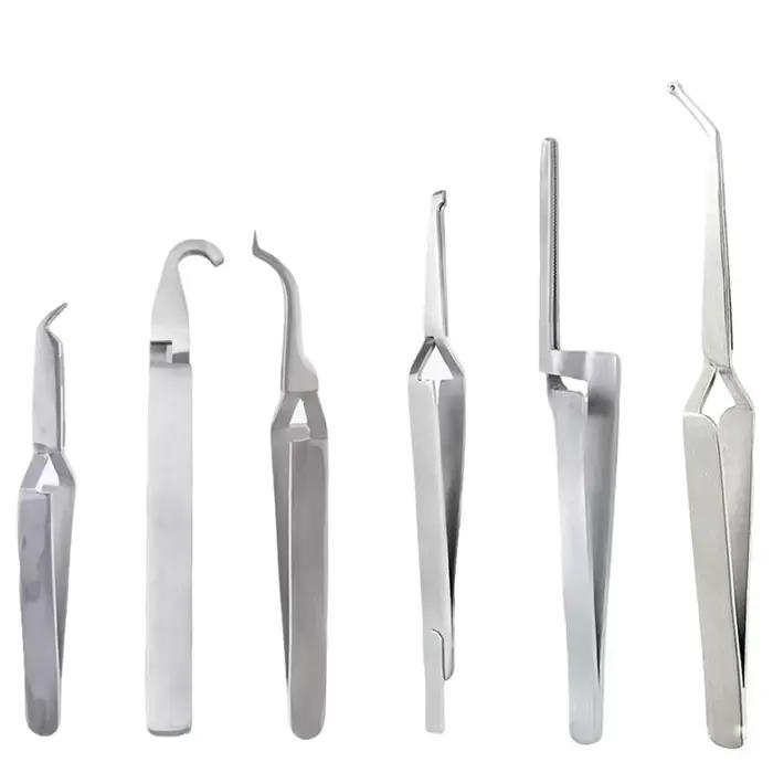 Ensemble orthodontique : pince à épiler, tube buccale et placages à boutons linguals, outils de liaison, porte-papier articulé